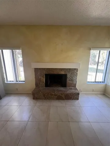a spacious bathroom with a sink a toilet and a window