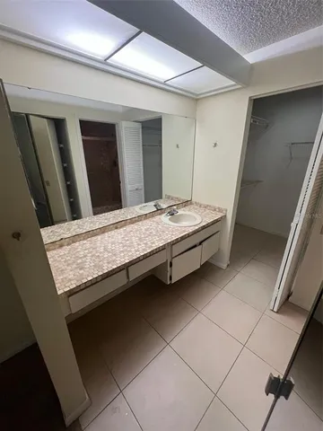 a bedroom with bed and window