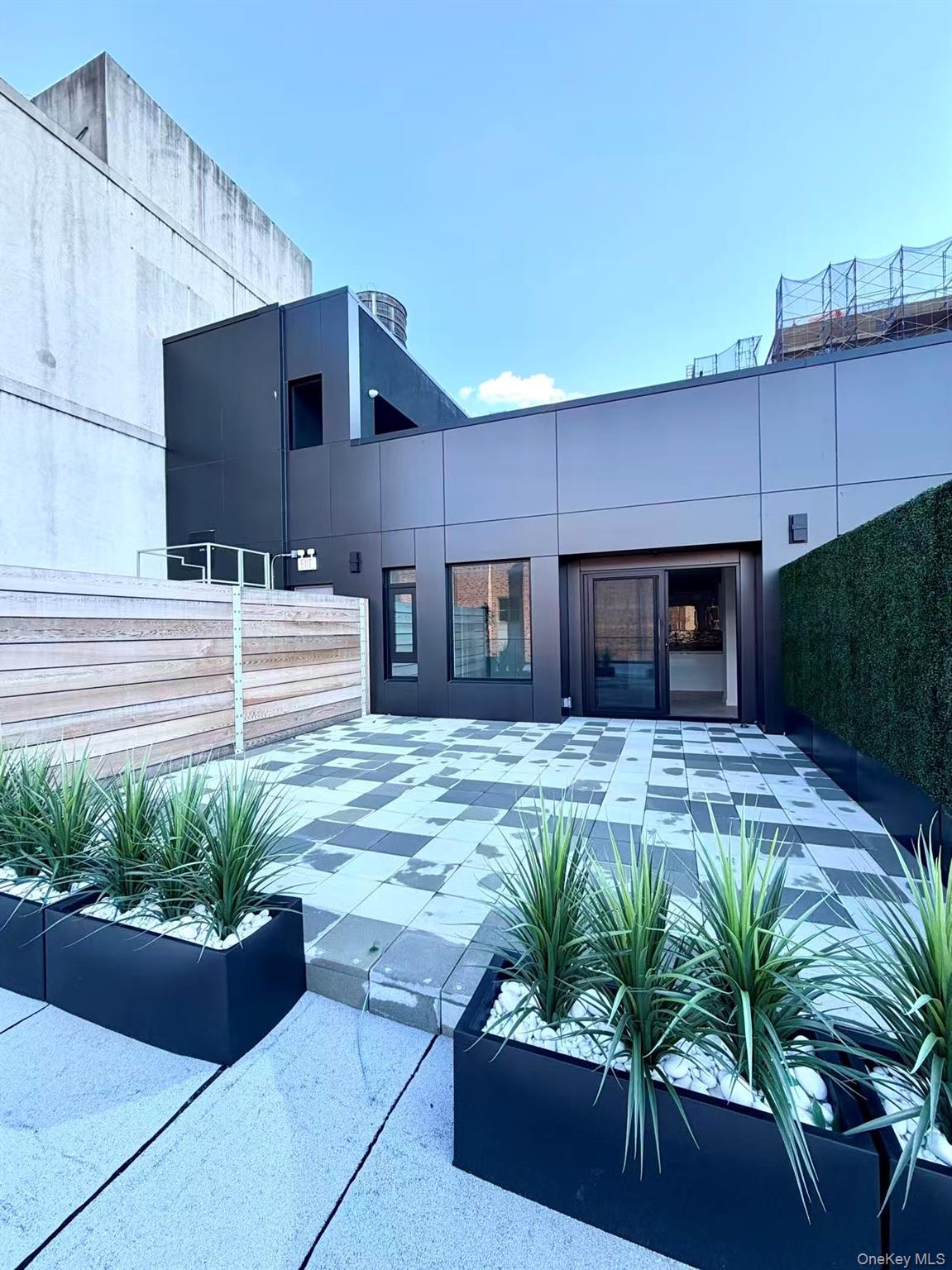 40-09 29th Street, Unit 2E Queens, NY 11101 - Photo 14 of 15 a house view with a garden space