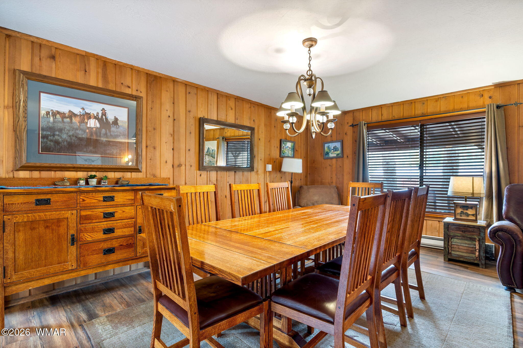 85 Main Street Greer, AZ 85927 - Photo 17 of 55 a view of a dining room with furniture window and wooden floor