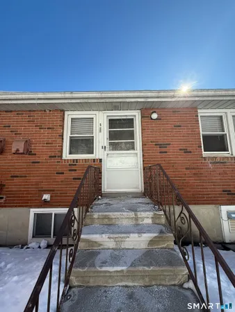 a view of a house with wooden deck