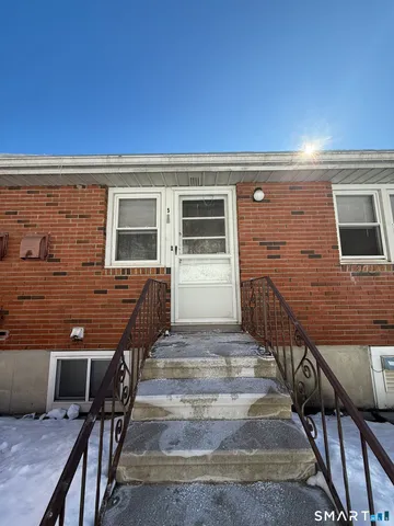 a view of a house with wooden deck