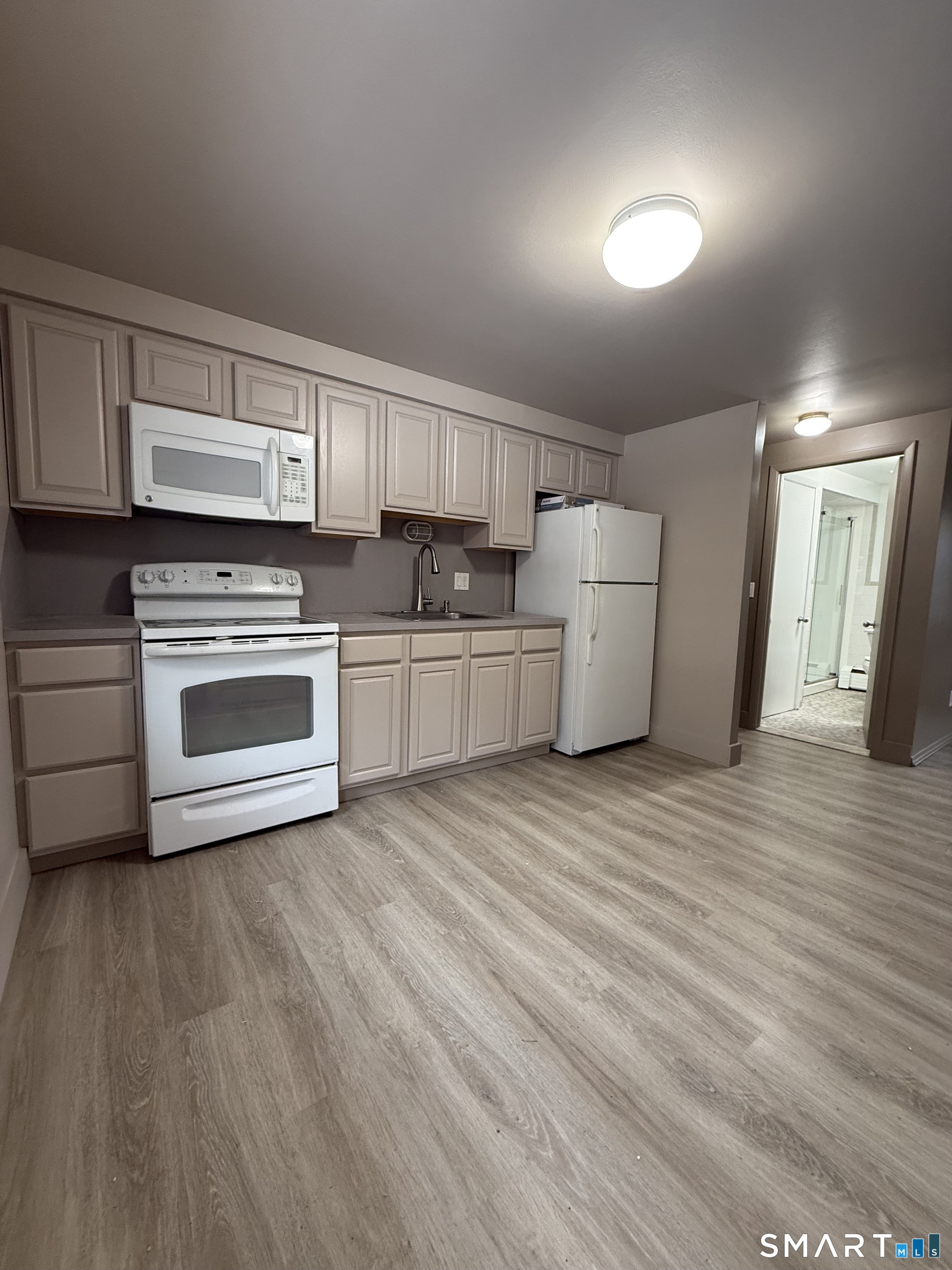 30 Bungay Road, Unit 5 Seymour, CT 06483 - Photo 10 of 14 a kitchen with a sink a stove and cabinets