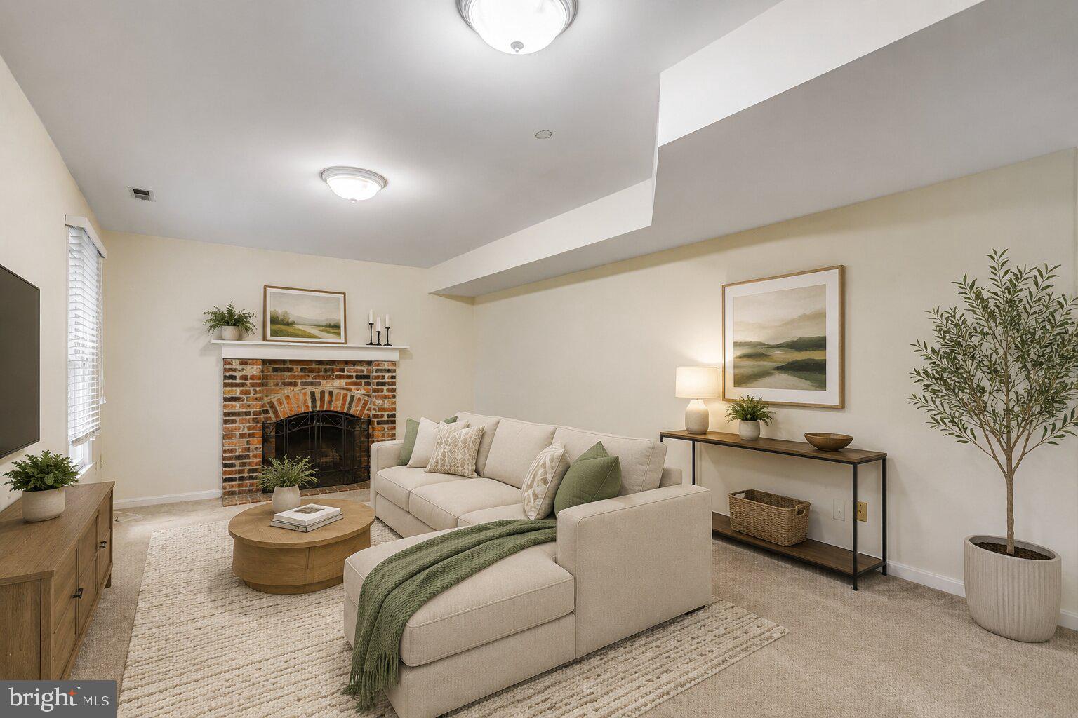 17303 Buehler Road Olney, MD 20832 - Photo 12 of 14 a living room with furniture and a fireplace
