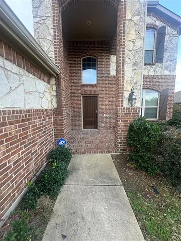 a kitchen with a stove sink and cabinets