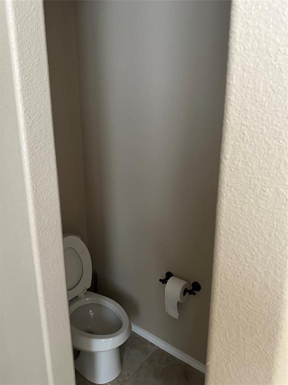 8404 Sioux Trail Aubrey, TX 76227 - Photo 8 of 20 a white toilet sitting next to a shower