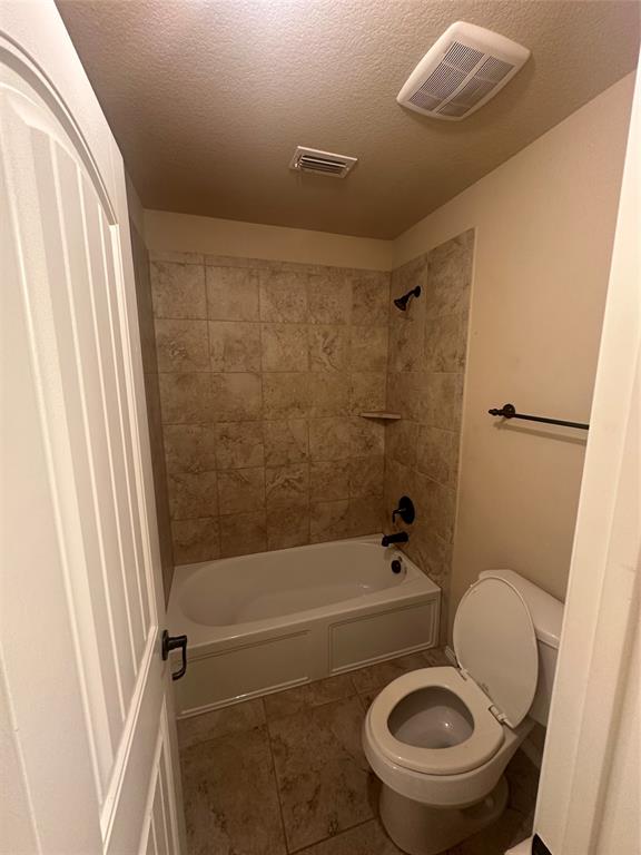 8404 Sioux Trail Aubrey, TX 76227 - Photo 9 of 20 a bathroom with a toilet and a shower