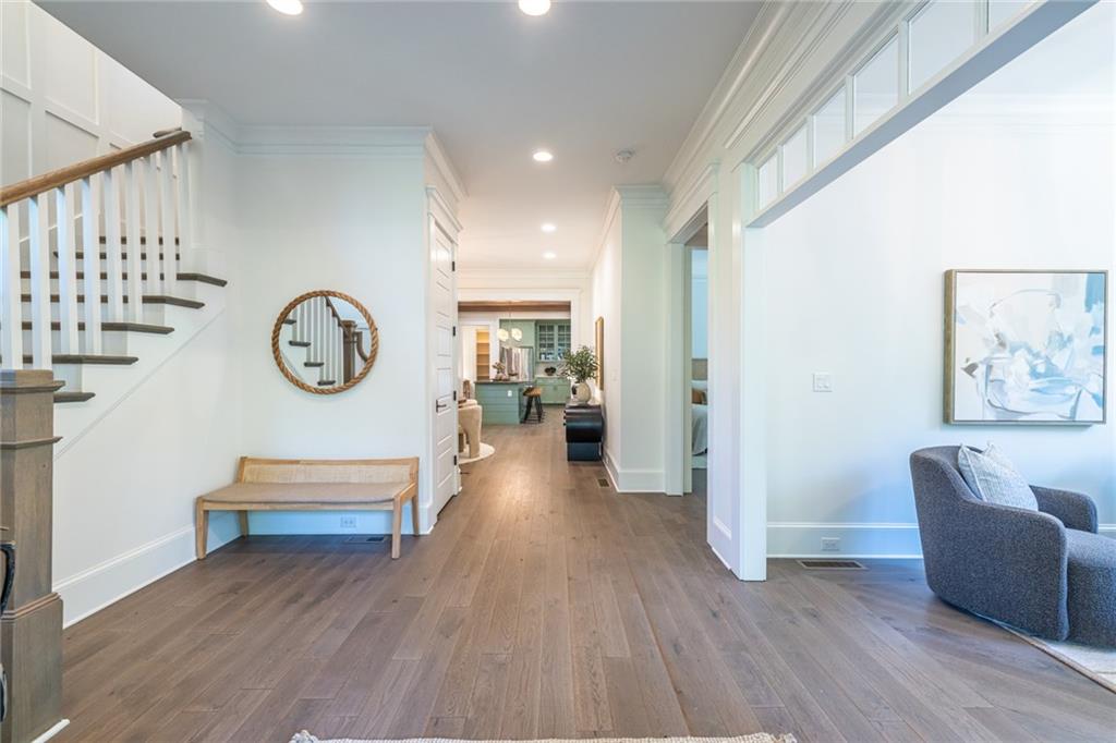 538 Ansley Street Decatur, GA 30030 - Photo 24 of 73 a view of a hallway with wooden floor and a bookshelf