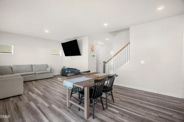 a view of a livingroom with furniture and a flat screen tv