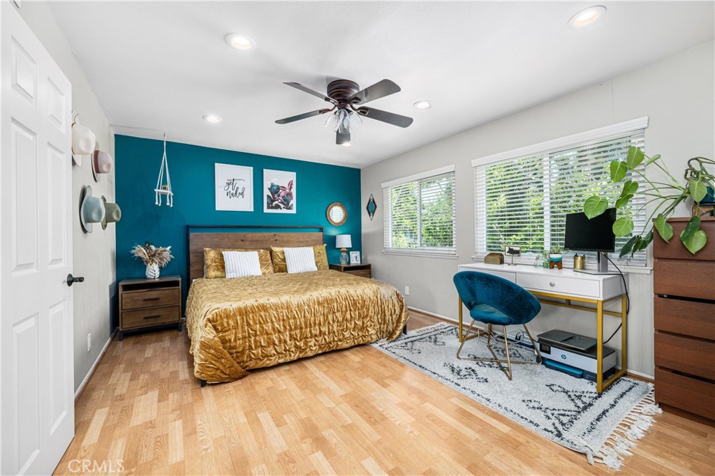 4237 Larwin Avenue Cypress, CA 90630 - Photo 23 of 48 a bedroom with a bed and a chair