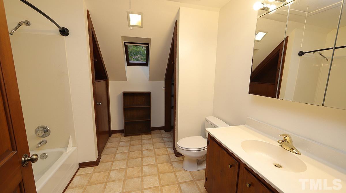 2413 Pleasant Union Church Road Raleigh, NC 27614 - Photo 22 of 30 Situated in upstairs hallway between the 2 Bedrooms. Convenient laundry shoot from this bath straight down to the Laundry closet.