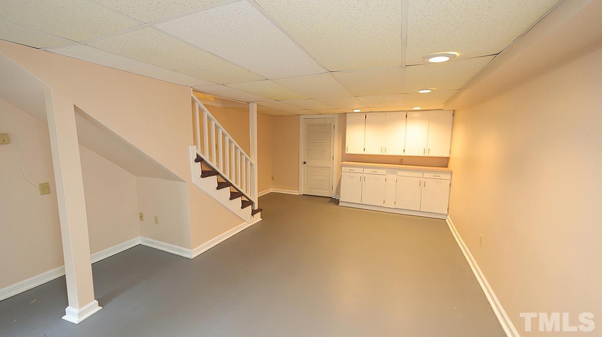 2413 Pleasant Union Church Road Raleigh, NC 27614 - Photo 26 of 30 Storage Room behind cabinets (light automatically comes on)