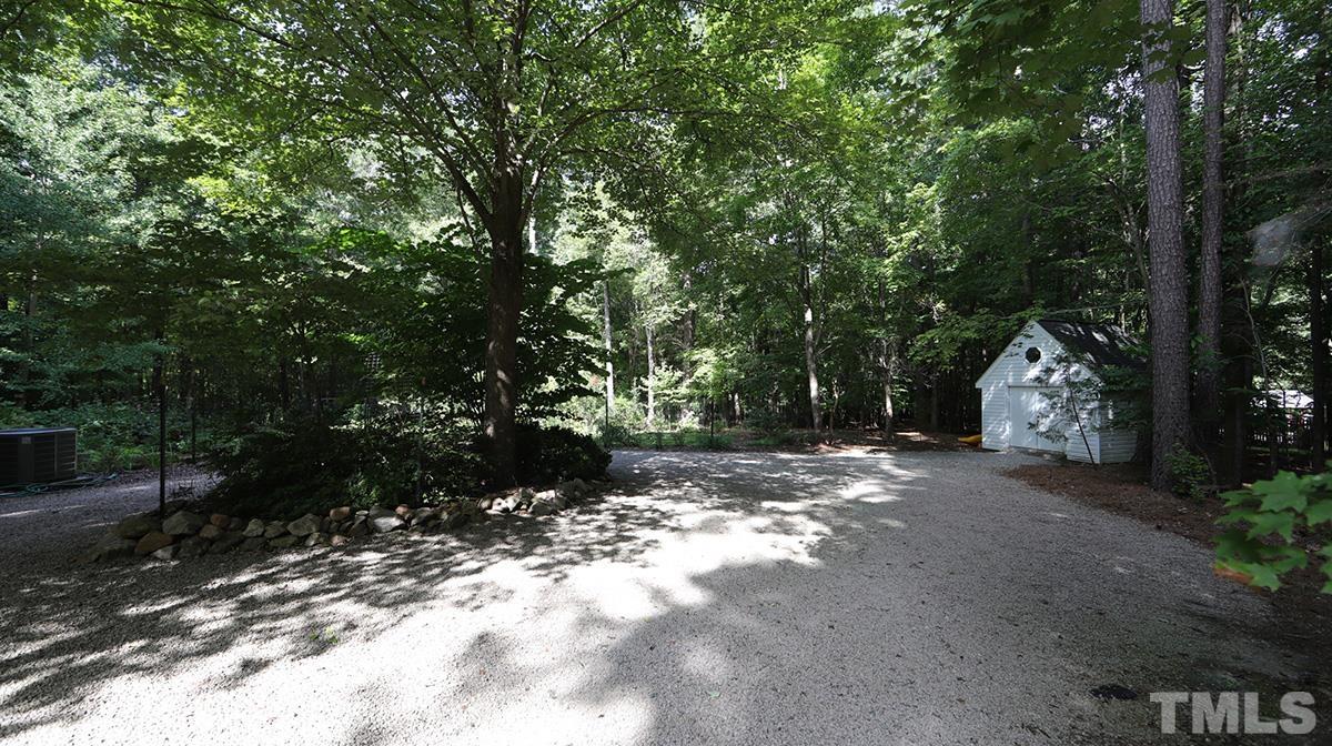 2413 Pleasant Union Church Road Raleigh, NC 27614 - Photo 28 of 30 Convenient circular driveway as well as roomy storage shed with shelving.