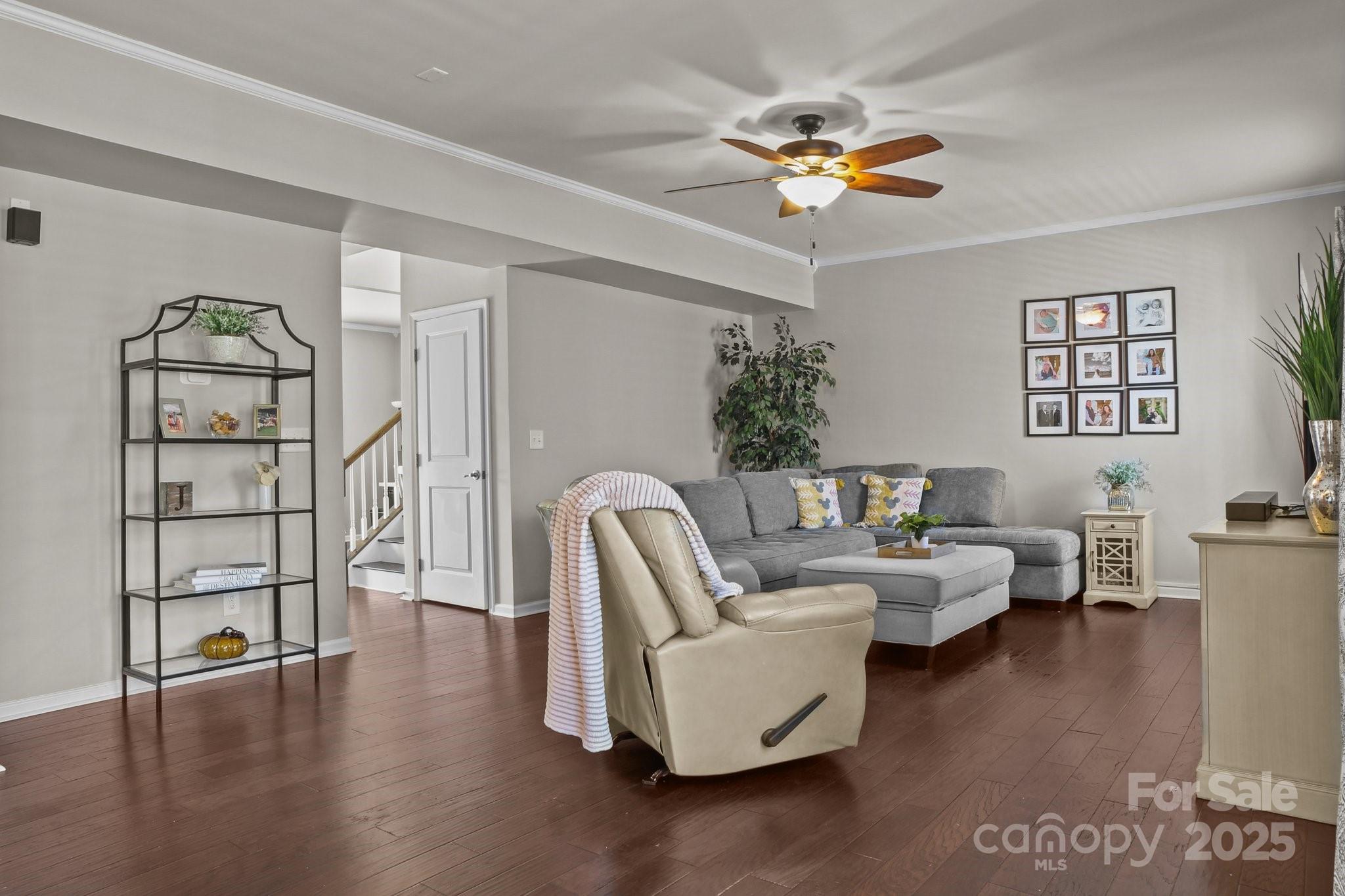 7520 West Berkeley Road Denver, NC 28037 - Photo 14 of 38 a living room with furniture a chandelier and a window