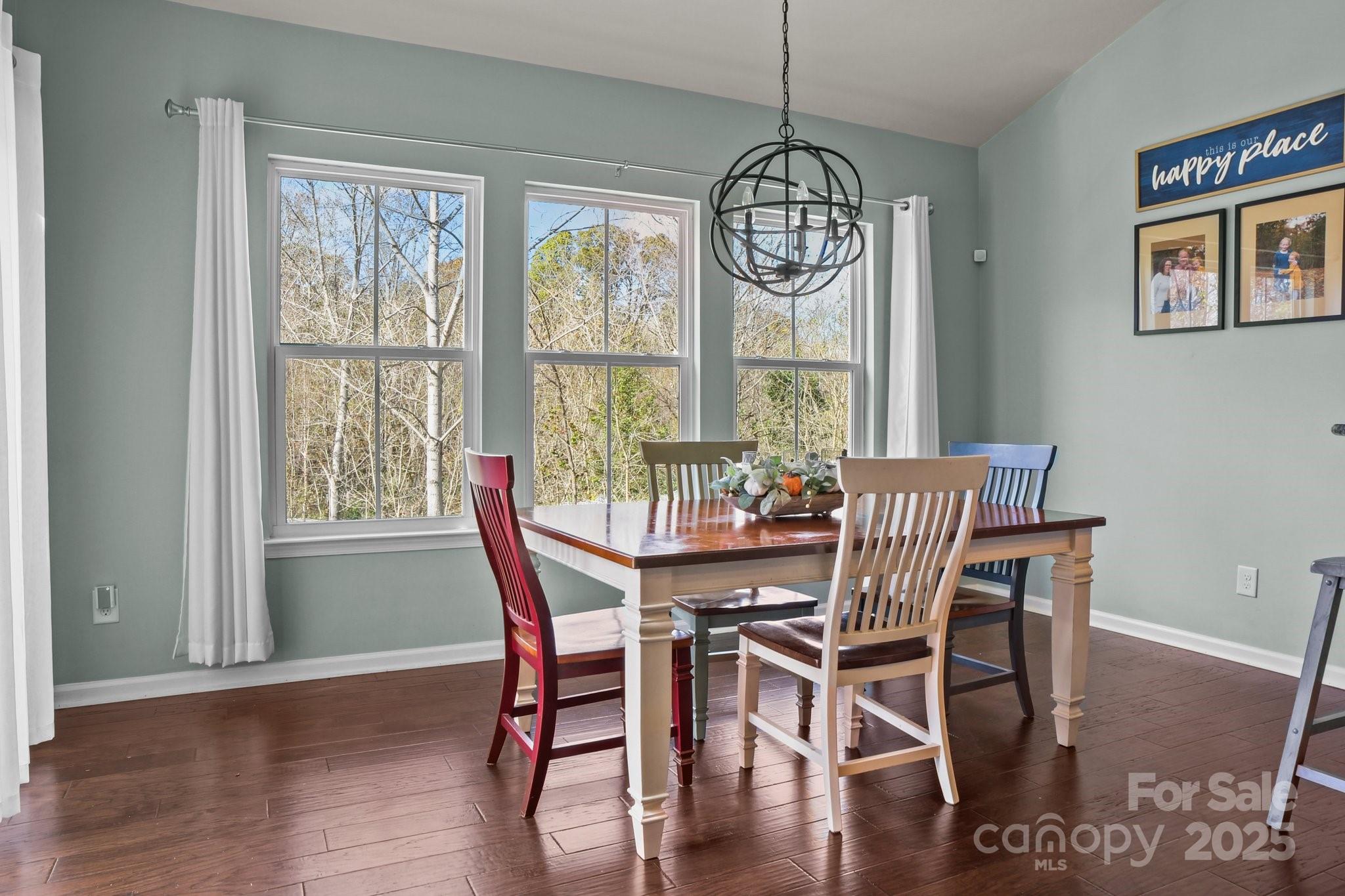 7520 West Berkeley Road Denver, NC 28037 - Photo 18 of 38 a view of a dining room with furniture window and wooden floor