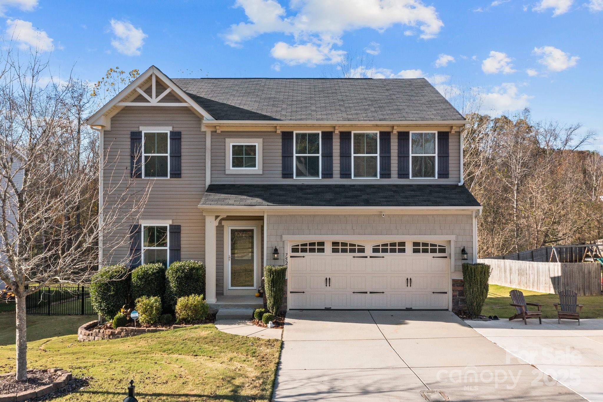 7520 West Berkeley Road Denver, NC 28037 - Photo 2 of 38 a front view of a house with a yard