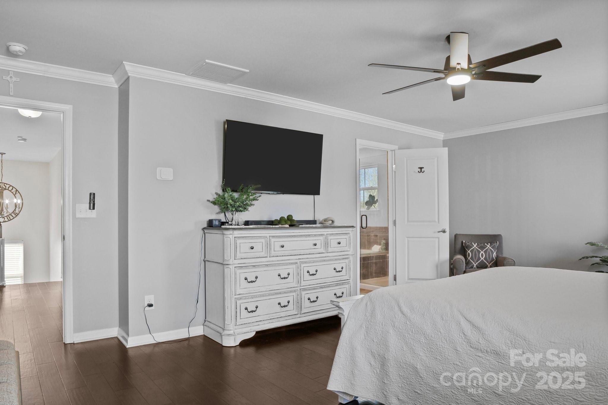 7520 West Berkeley Road Denver, NC 28037 - Photo 25 of 38 a bedroom with a bed and a flat screen tv