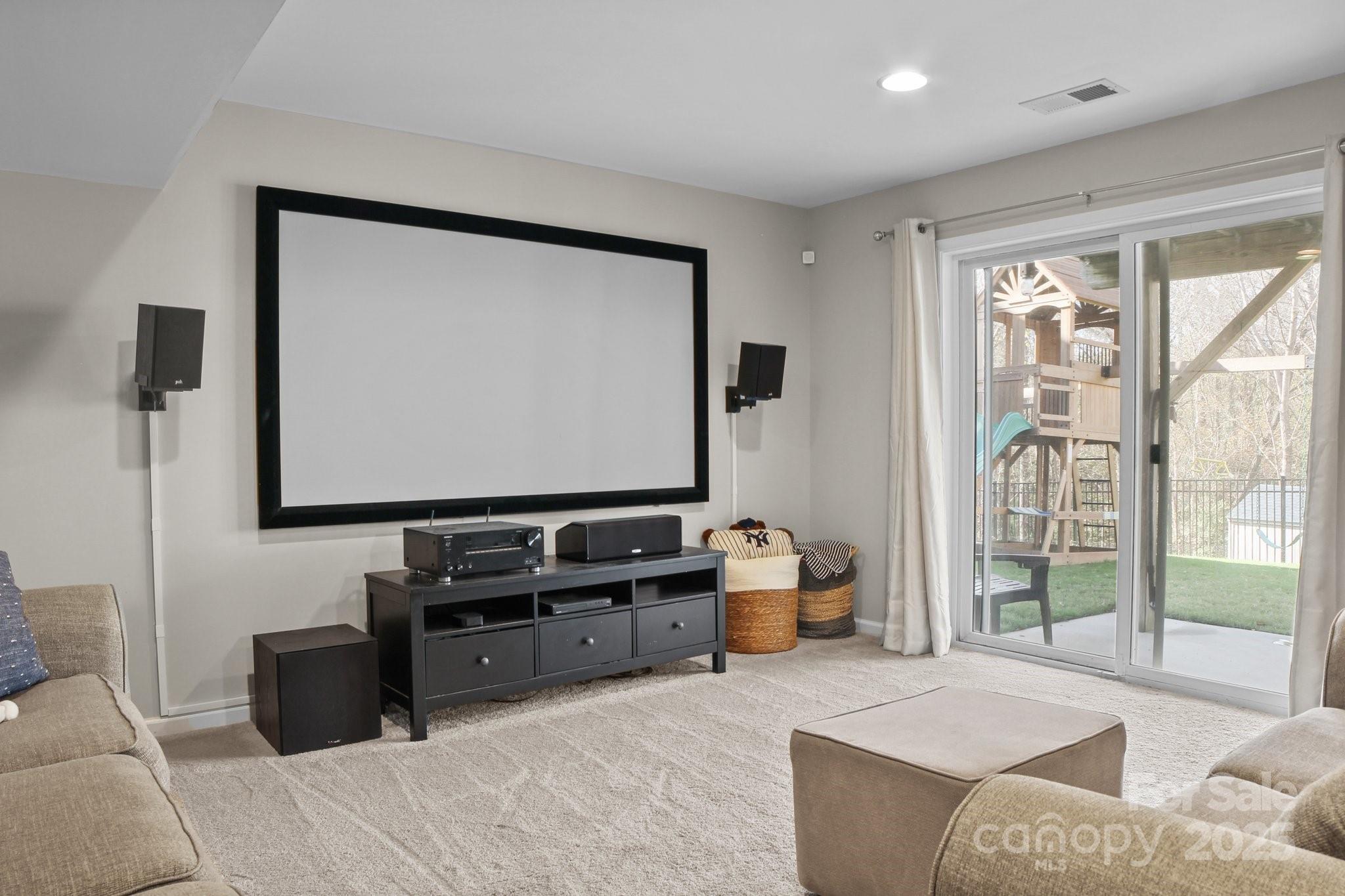 7520 West Berkeley Road Denver, NC 28037 - Photo 31 of 38 a living room with furniture and a flat screen tv