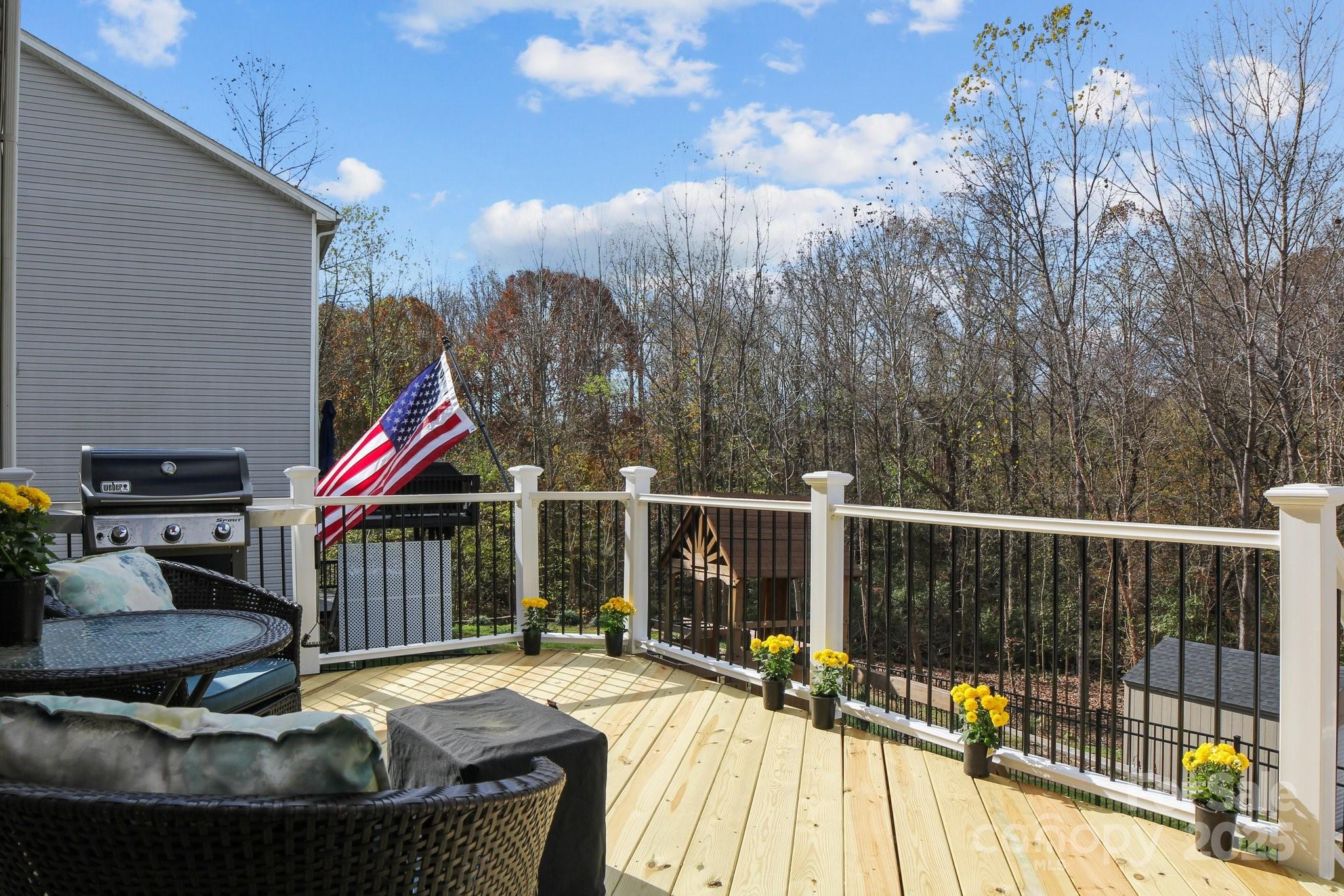 7520 West Berkeley Road Denver, NC 28037 - Photo 6 of 38 a view of a balcony with chairs and wooden floor