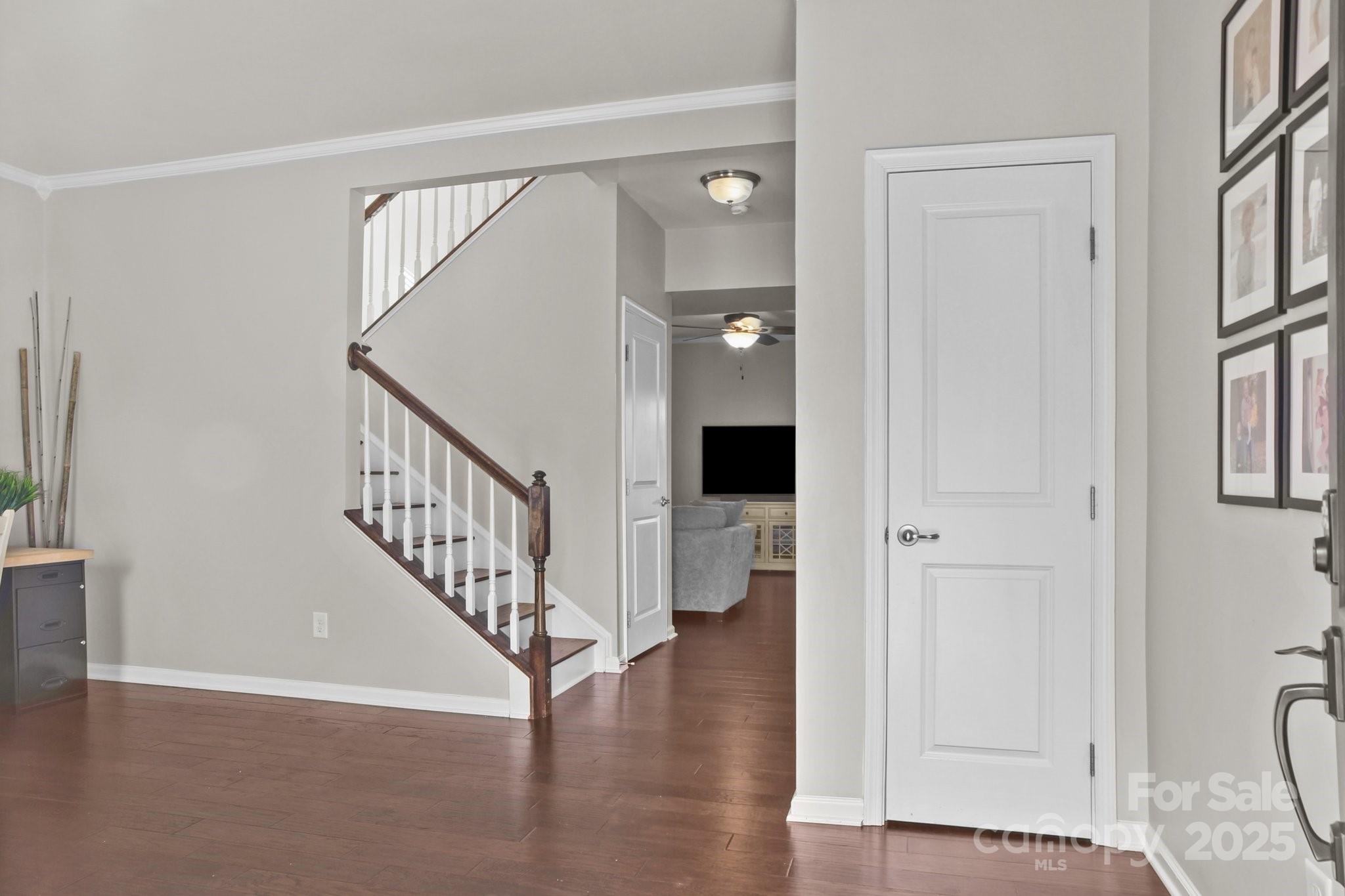 7520 West Berkeley Road Denver, NC 28037 - Photo 9 of 38 a view of entryway with wooden floor and stairs