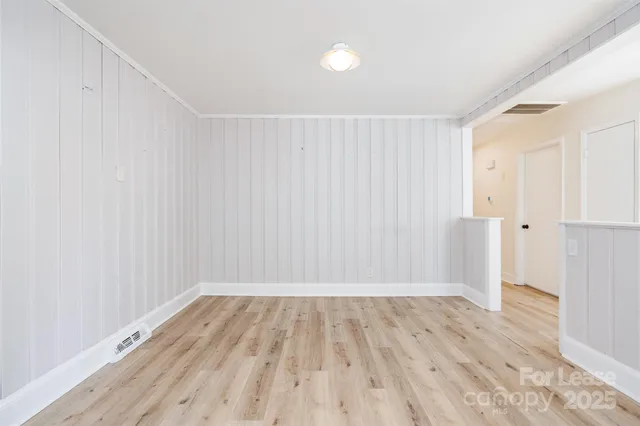 a view of wooden floor in an empty room