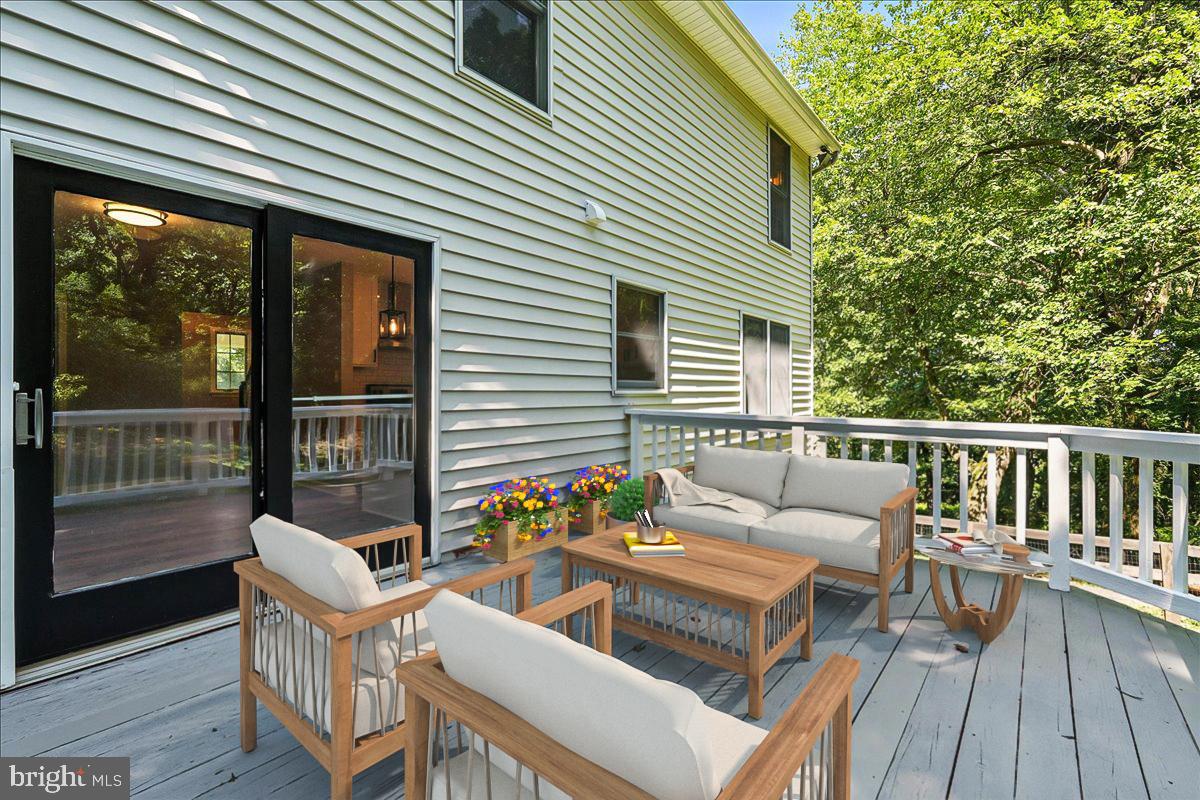 5757 Elkridge Heights Road Elkridge, MD 21075 - Photo 11 of 43 a balcony with table and chairs