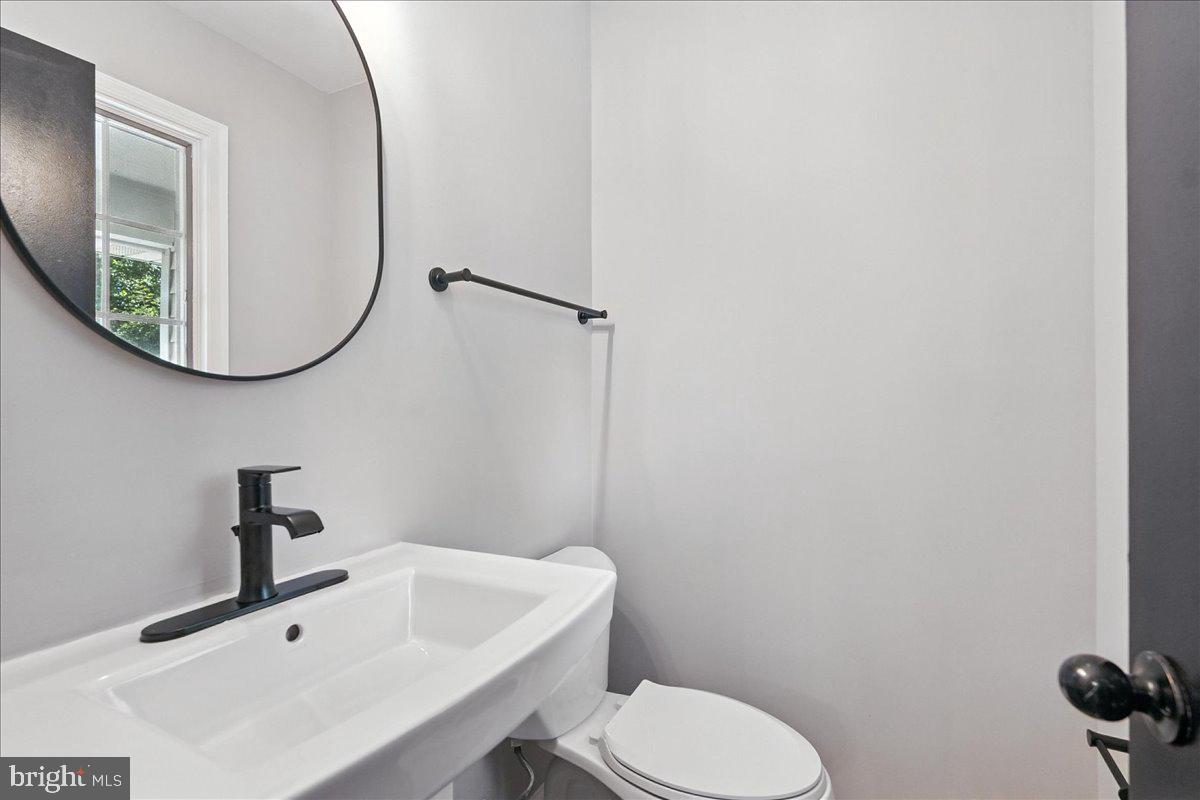 5757 Elkridge Heights Road Elkridge, MD 21075 - Photo 15 of 43 a bathroom with a sink and mirror