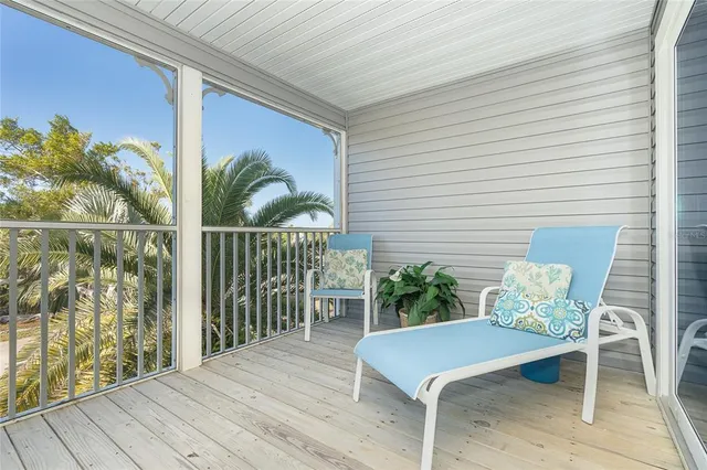 a view of a balcony with furniture