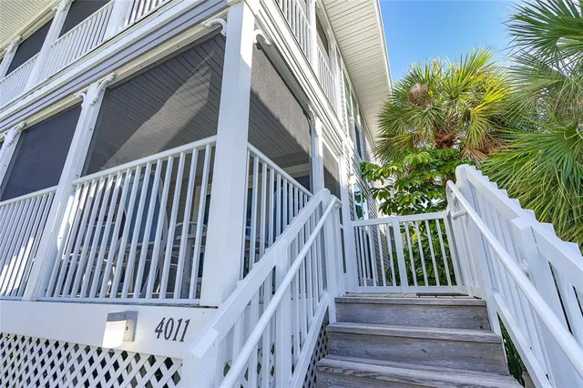 a view of balcony with wooden floor and fence