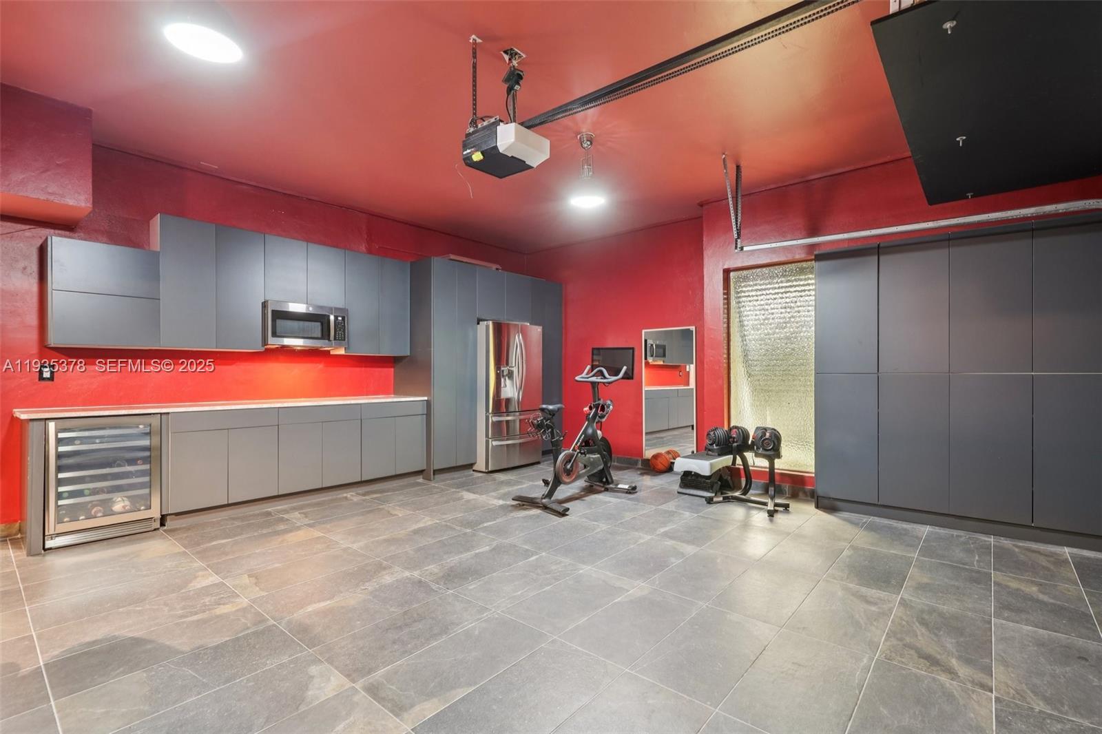 8375 Southwest 185th Terrace Cutler Bay, FL 33157 - Photo 19 of 35 a room with gym equipment and white walls