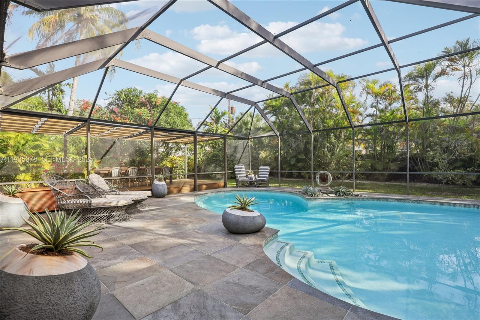 8375 Southwest 185th Terrace Cutler Bay, FL 33157 - Photo 22 of 35 a living room with couch and a table