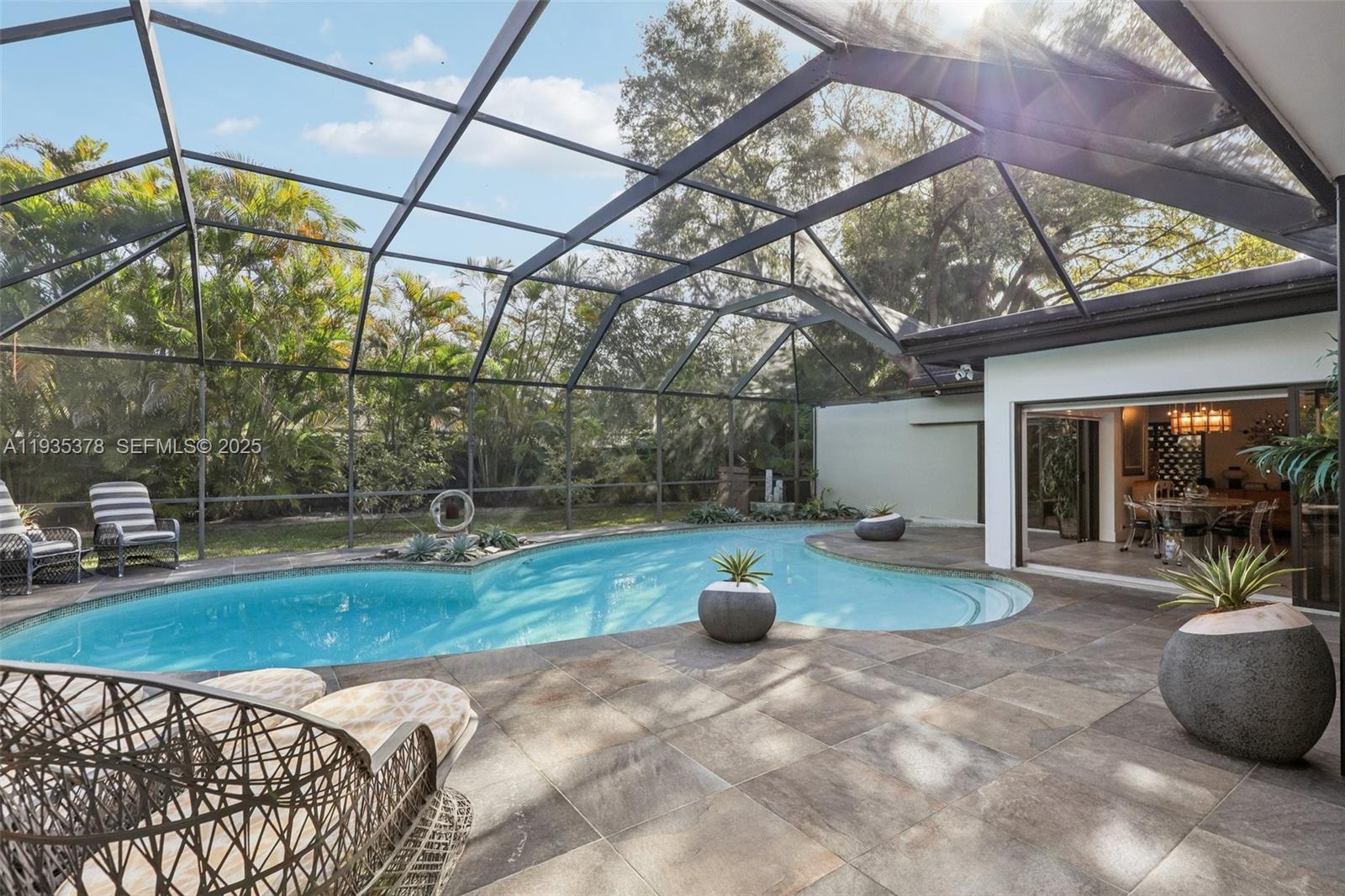 8375 Southwest 185th Terrace Cutler Bay, FL 33157 - Photo 23 of 35 a view of a backyard with sitting area and furniture