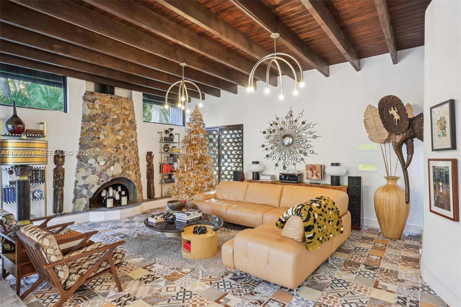 8375 Southwest 185th Terrace Cutler Bay, FL 33157 - Photo 3 of 35 a living room with furniture windows and a chandelier