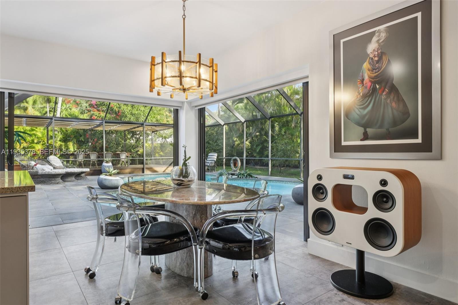 8375 Southwest 185th Terrace Cutler Bay, FL 33157 - Photo 4 of 35 a view of a dining room with furniture large windows and outer view