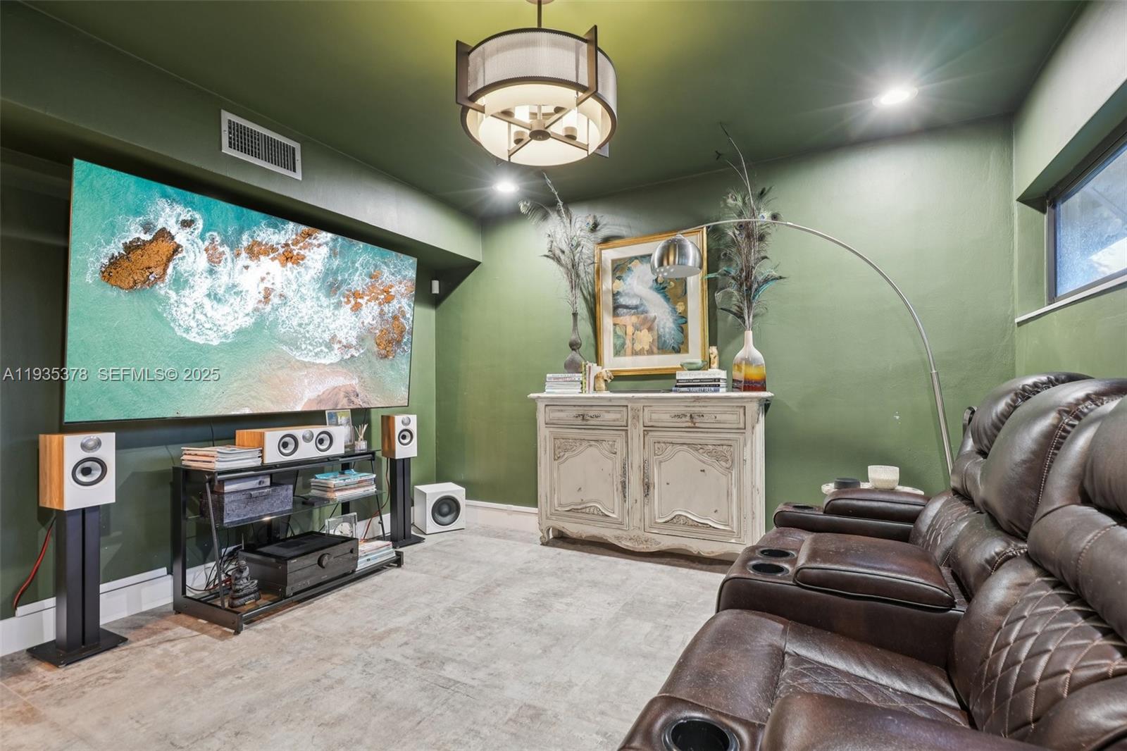 8375 Southwest 185th Terrace Cutler Bay, FL 33157 - Photo 9 of 35 a view of a livingroom with furniture and a flat screen tv