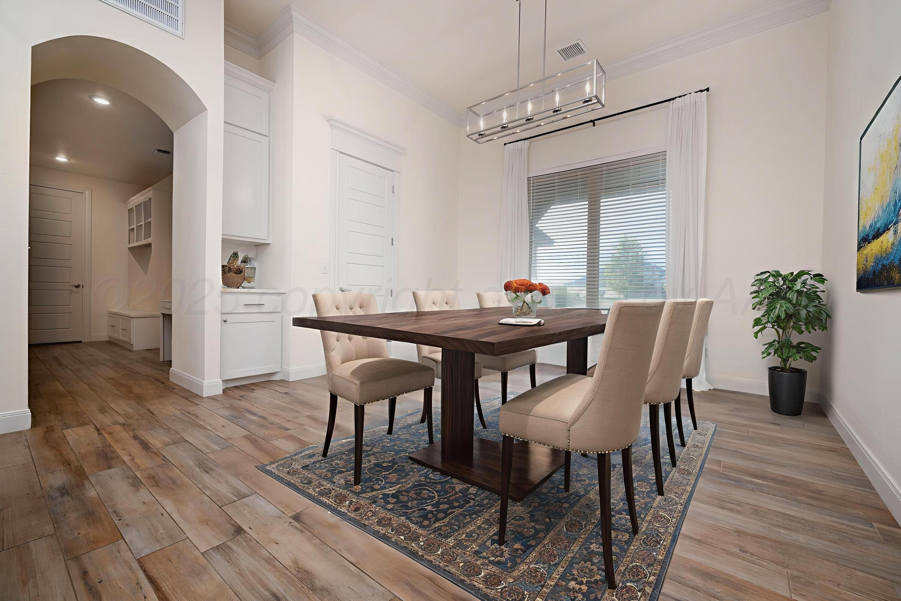 19350 Falcon Ridge Road Amarillo, TX 79124 - Photo 12 of 41 a view of a dining room with furniture window and wooden floor