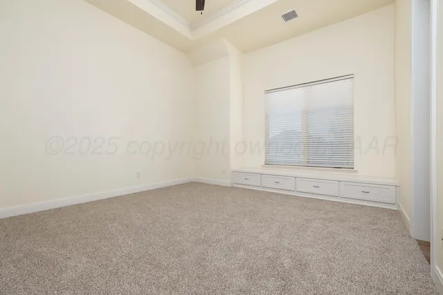 an empty room with a empty space and windows