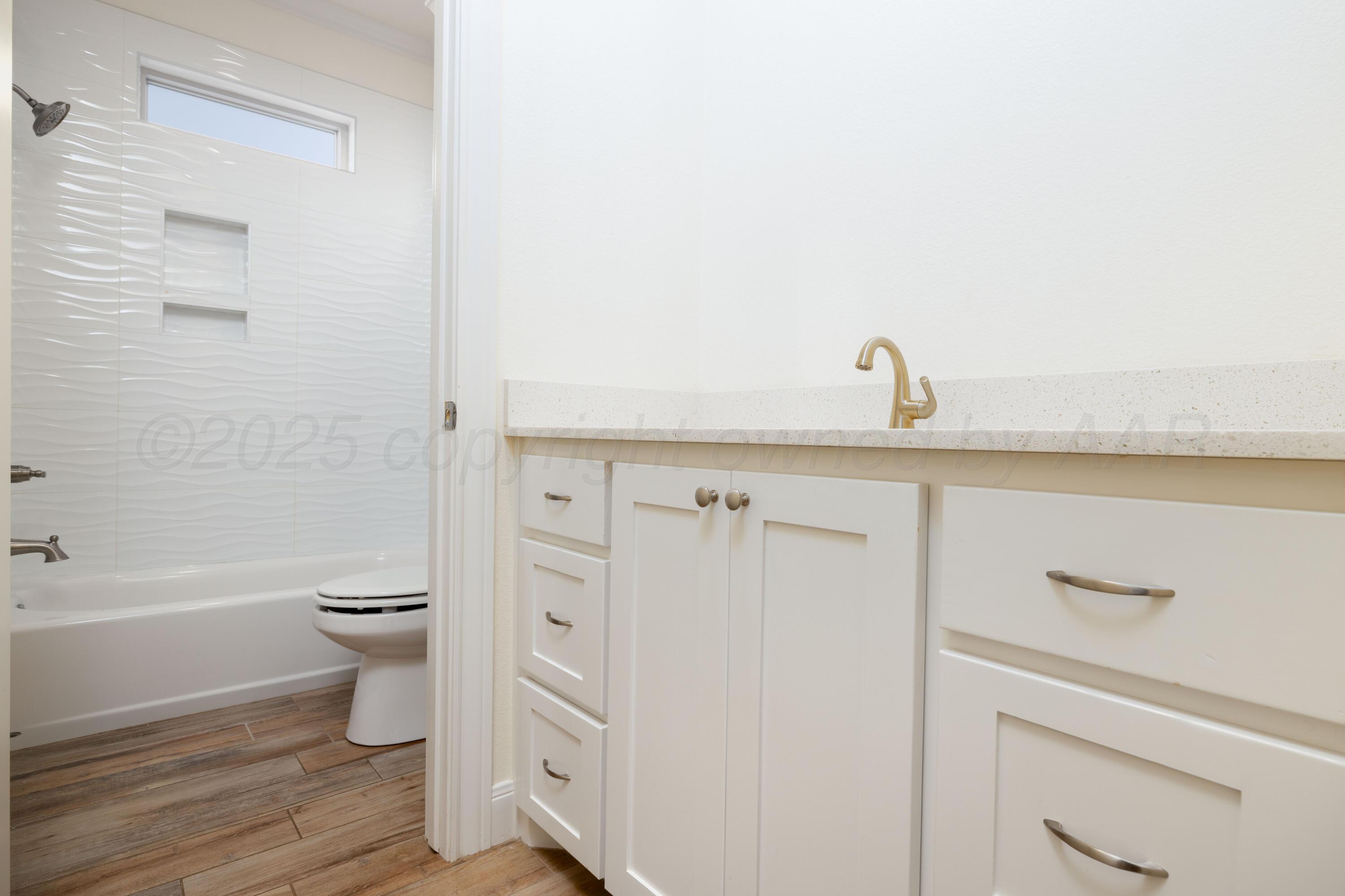 19350 Falcon Ridge Road Amarillo, TX 79124 - Photo 25 of 41 a bathroom with a sink a toilet and shower