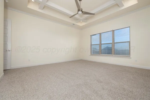 an empty room with a empty space and windows