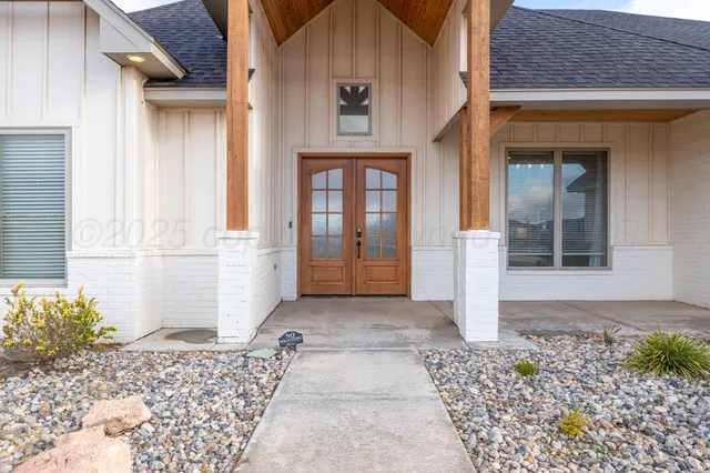a view of a brick house with a outdoor space