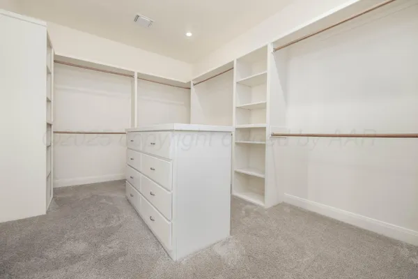 a view of an empty walk in closet