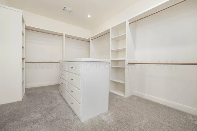 a view of an empty walk in closet