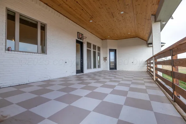 a view of a brick house with a large windows