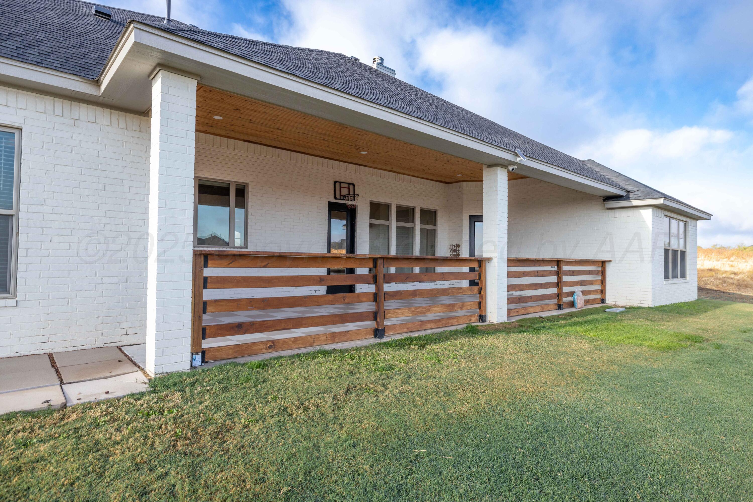 19350 Falcon Ridge Road Amarillo, TX 79124 - Photo 37 of 41 a view of a house with a yard