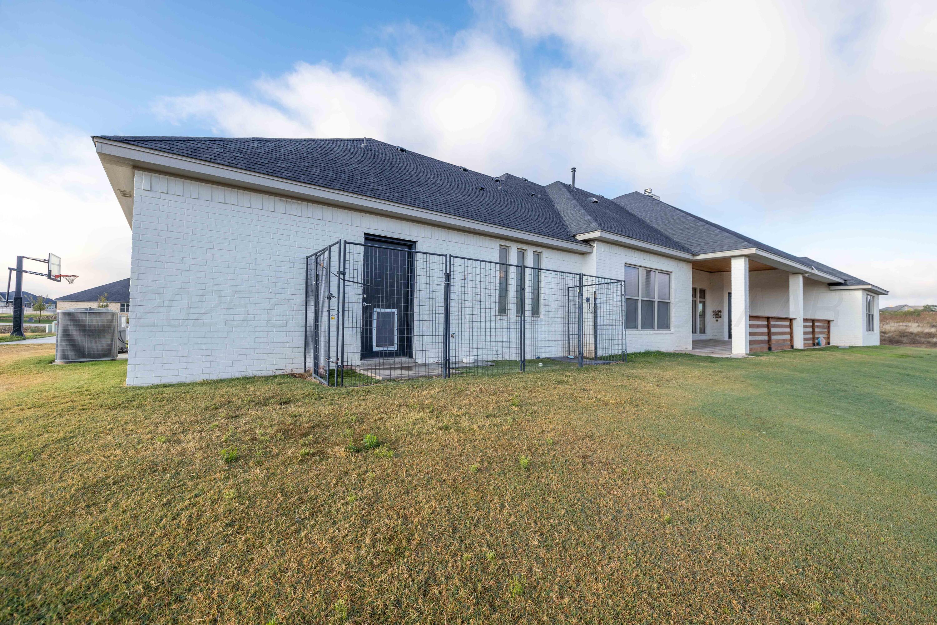 19350 Falcon Ridge Road Amarillo, TX 79124 - Photo 40 of 41 a front view of a house with a garden