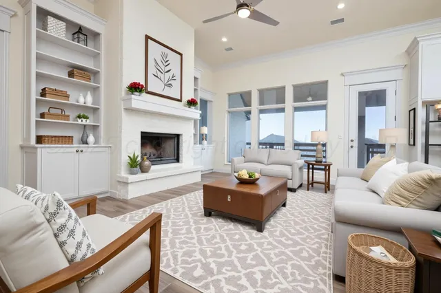 a living room with furniture and a fireplace