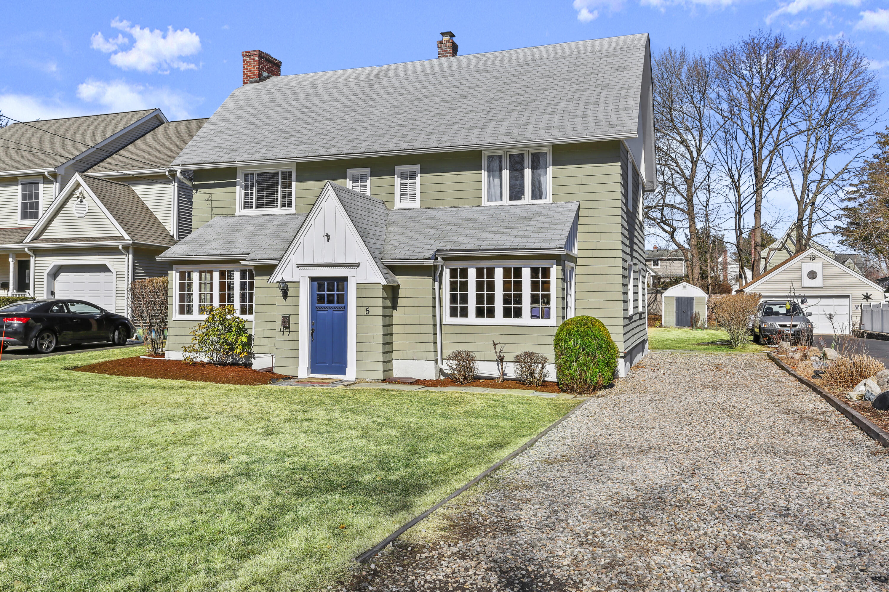 5 Hazel Street Norwalk, CT 06851 - Photo 2 of 32 a front view of a house with a yard and porch