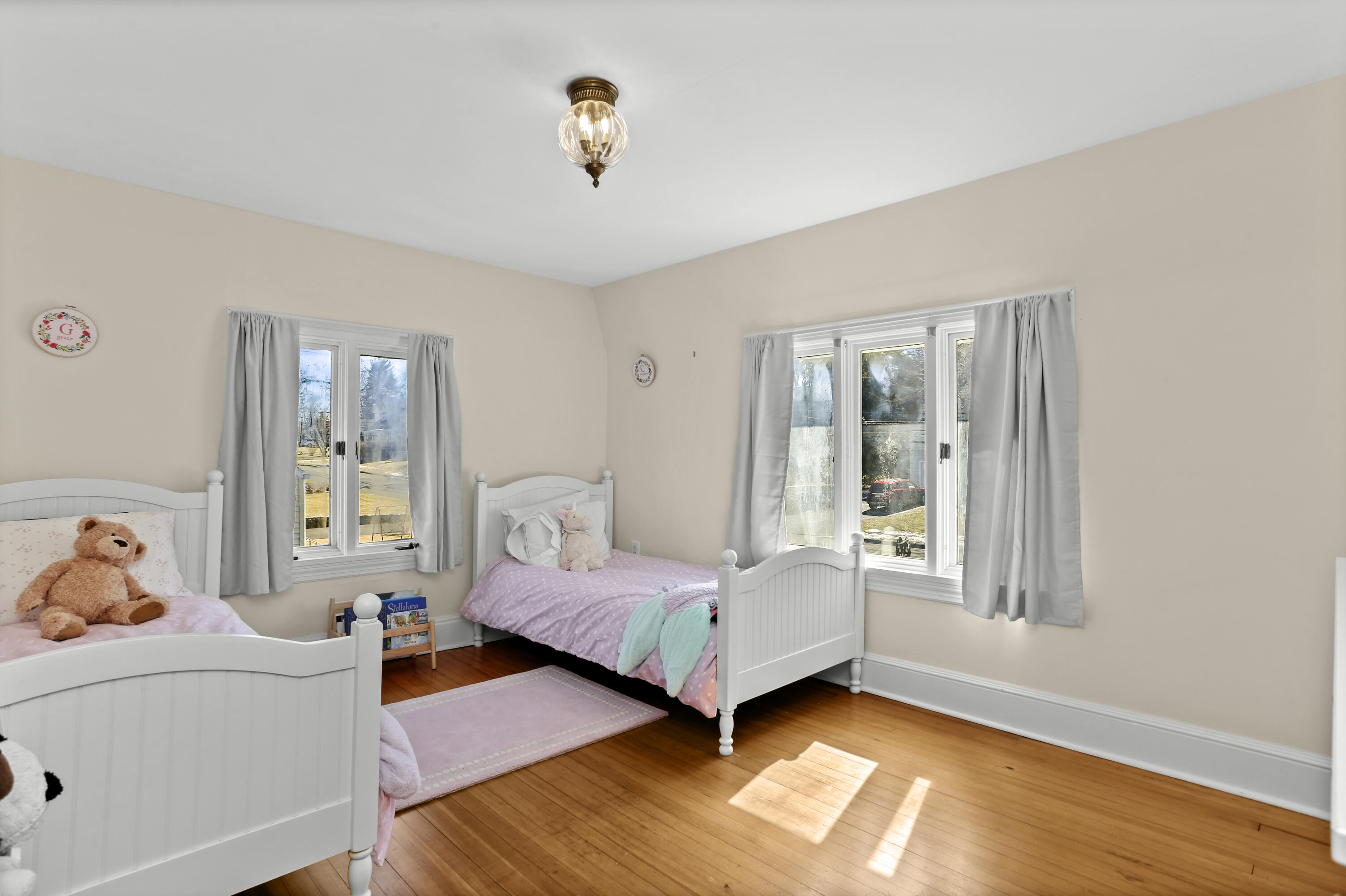 5 Hazel Street Norwalk, CT 06851 - Photo 23 of 32 a bedroom with a bed and wooden floor