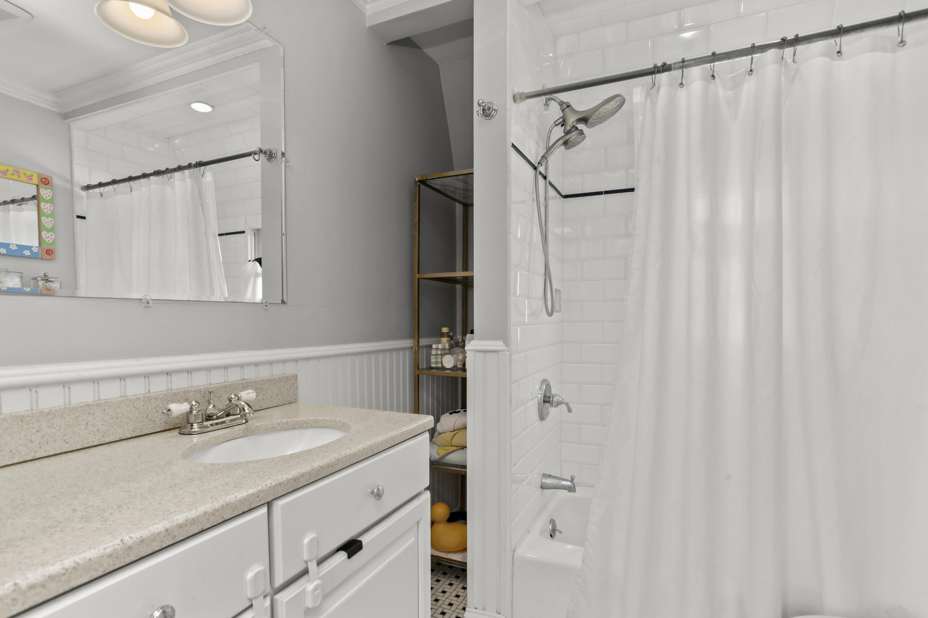 5 Hazel Street Norwalk, CT 06851 - Photo 25 of 32 a bathroom with a granite countertop sink and a mirror