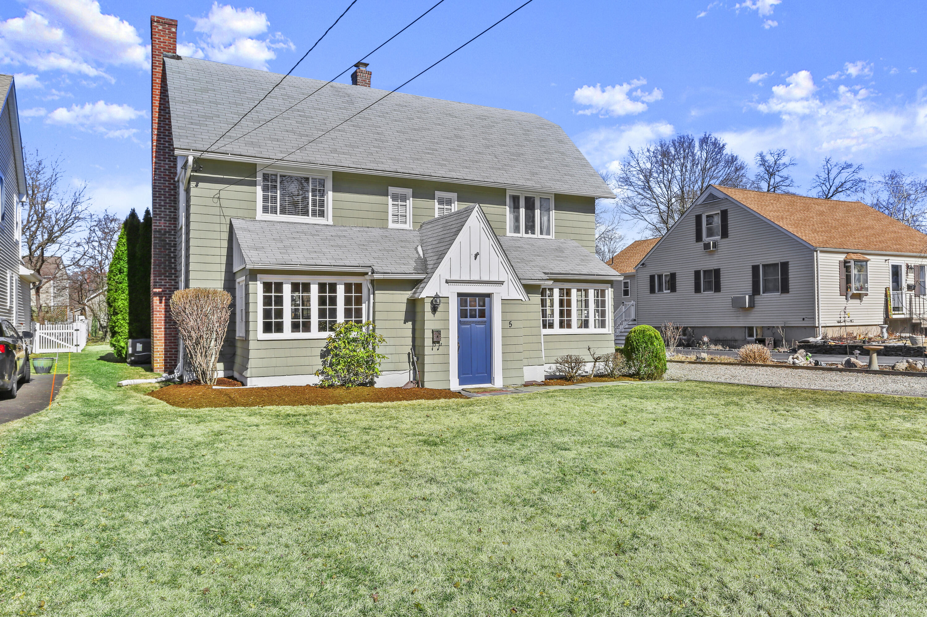 5 Hazel Street Norwalk, CT 06851 - Photo 26 of 32 a front view of a house with a yard